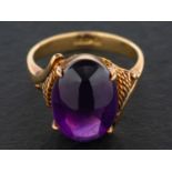 A cabochon-cut amethyst ring, estimated amethyst weight ca.