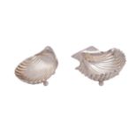 WITHDRAWN Two Mexican silver shell-shaped dishes, 925 stamped marks each raised on ball feet,