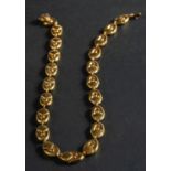 A 1970's, 18ct gold, fancy-link necklace, with import marks for London, 1976, total length ca. 39.