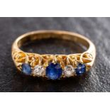 An 18ct gold, Edwardian, sapphire and old-cut diamond, five-stone ring, total diamond weight ca. 0.