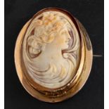 An Art Nouveau shell cameo brooch/ pendant, depicting Hebe, goddess of youth, stamped '9CT',