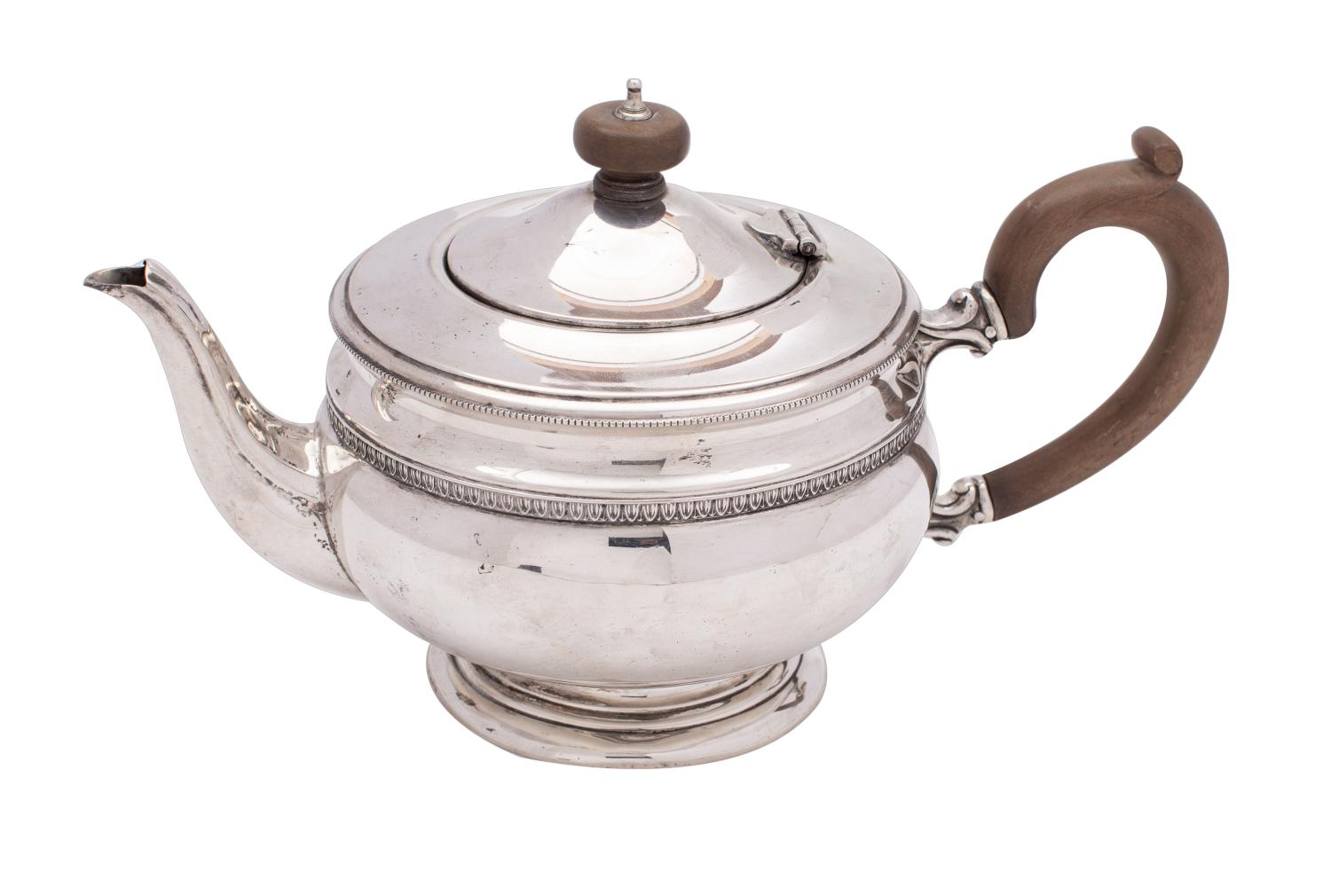 A George V silver teapot, maker Mappin & Webb, London, 1910 of circular waisted form,
