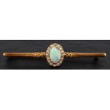 An oval cabochon-cut opal and old-cut diamond cluster bar brooch, estimated opal weight ca. 0.