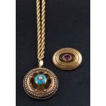 An Estruscan style gold locket pendant and a Greek key pattern locket brooch,