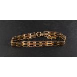 A gate-link bracelet, stamped '9CT', length ca. 18cm, total weight ca. 7.8gms.