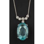 An oval, mixed-cut aquamarine and old-cut diamond pendant, estimated aquamarine weight ca. 11.