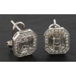 A pair of round, brilliant, calibre and octagonal, step-cut, diamond cluster ear studs,