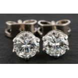 A pair of round, brilliant-cut diamond ear studs, total estimated diamond weight ca. 0.