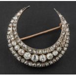 A Victorian, old, single and rose-cut diamond, crescent brooch,