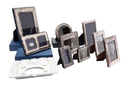 A group of nine modern silver photo frames,