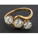 An old-cut diamond, three-stone, cross-over ring, total estimated diamond weight ca.