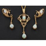 A 9ct gold openwork opal pendant and pair of earrings, the earrings with post fittings,