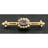 An amethyst and seed pearl bar brooch, length of brooch ca. 4.6cm, total weight ca. 5.6gms.