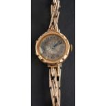 An early 20th century dress wristwatch, the silvered enamel dial with black Arabic numerals,