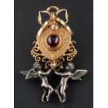 A heart-shaped brooch/ pendant, set with a circular, cabochon-cut garnet and a rose-cut diamond,