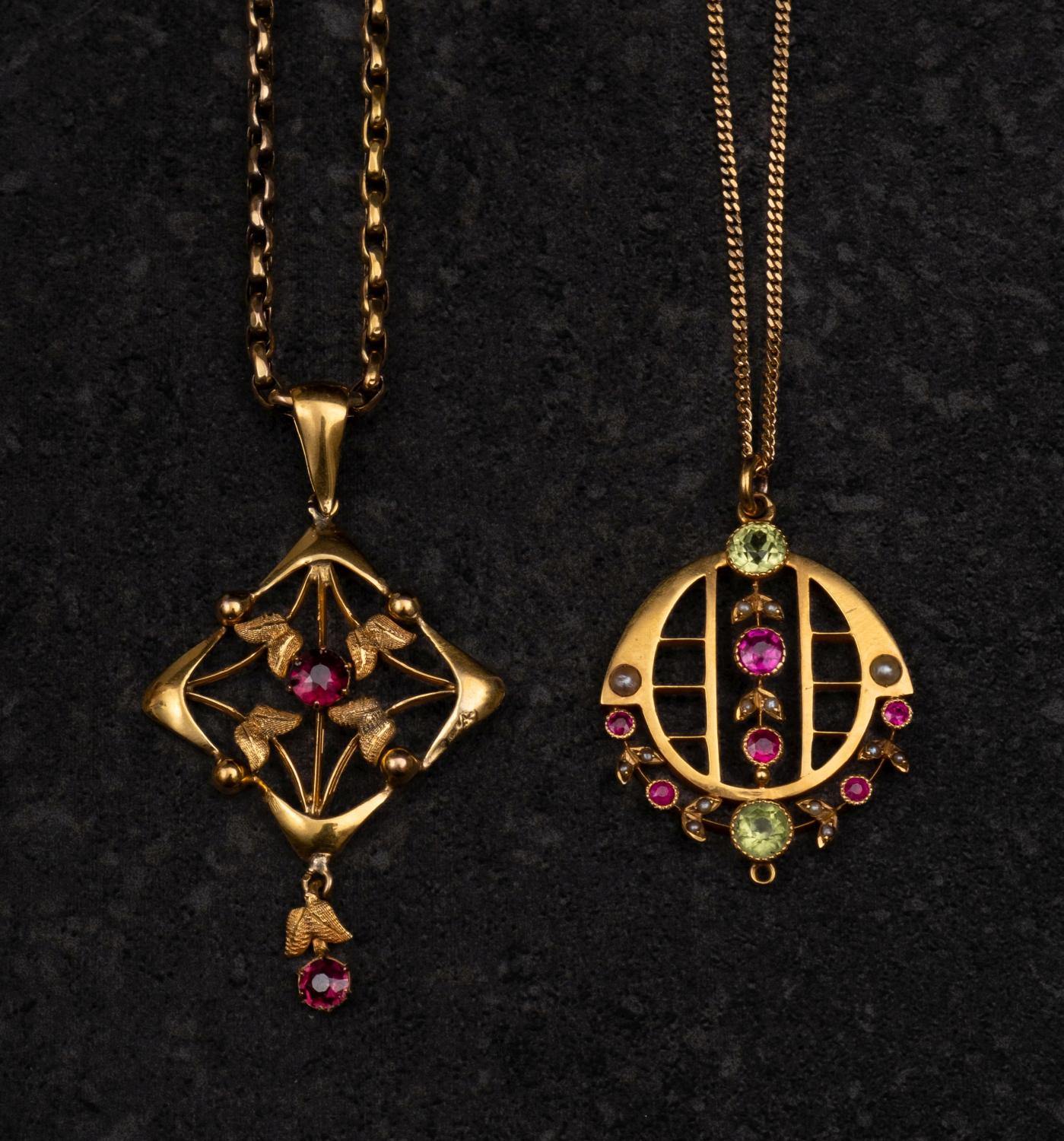 Two gemset, openwork pendants, including a ruby, peridot and seed pearl pendant,