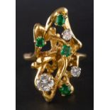 A 1960's round, brilliant-cut diamond and emerald dress ring, total estimated diamond weight ca. 0.