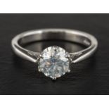 A platinum, round, brilliant-cut diamond, single-stone ring,