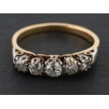 A round brilliant and old-cut diamond five-stone ring, total estimated diamond weight ca. 0.
