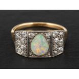 An oval, cabochon-cut opal and single-cut diamond cluster ring, estimated opal weight ca. 0.