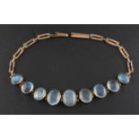 An oval, cabochon-cut moonstone gate-link bracelet, total estimated moonstone weight ca.