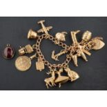 A 9ct gold, curb-link charm bracelet with heart-shaped clasp, with hallmarks for 1987,