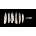 A collection of silver folding fruit knives with mother-of-pearl handles, various makers and dates,