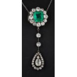 An octagonal step cut emerald and old-cut diamond cluster with pear-shaped diamond drop pendant