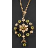 An openwork, green paste and seed pearl necklace, with central flowerhead design,