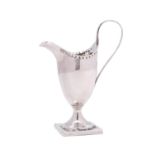 A George III silver cream jug, maker Hester Bateman, London, 1809, of helmet shaped outline,