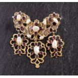 A 19th century, flat-cut, foil backed garnet and baroque-shaped pearl stomacher brooch/ pendant,