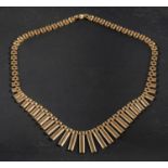 A panther-link, graduated fringe necklace, stamped '9K', total length ca. 40.5cm, total weight ca.