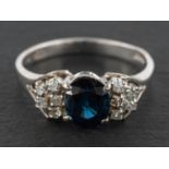 An 18ct gold, oval, mixed-cut sapphire and single-cut diamond ring, estimated sapphire weight ca.