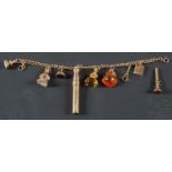 A curb-link charm bracelet, stamped '9CT', including a citrine swivel fob, two agate fobs,