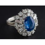 An oval, mixed-cut sapphire, baguette and round, brilliant-cut diamond dress ring,