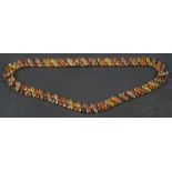 A vari-coloured gemset collar necklace,