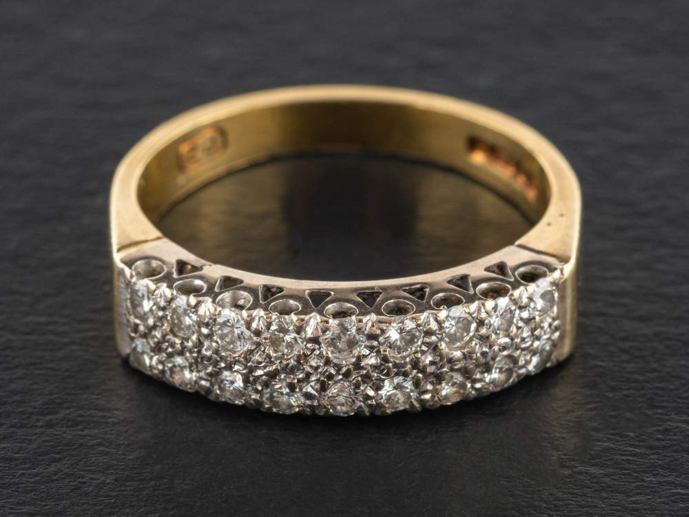 An 18ct gold, two-row, round, brilliant-cut diamond, half-eternity ring,