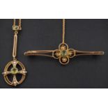 An openwork peridot and seed pearl brooch and pendant, the brooch stamped '15CT', the pendant '9CT',