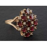 A 9ct gold, garnet and white paste cluster ring of chequerboard design, with hallmarks for London,
