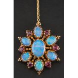 A 9ct gold, oval, cabochon-cut opal and mixed-cut ruby pendant/ brooch,