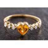 An 18ct gold, heart-shaped yellow sapphire and round, brilliant-cut diamond ring,