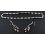 An early-mid 20th century, white paste riviere necklace and chandelier earrings,