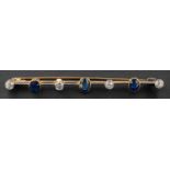 An old-cut diamond and oval, mixed-cut sapphire bar brooch, total estimated diamond weight ca. 0.