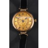 A 9ct gold wristwatch, the gilded dial with Roman numerals on engraved floral background,