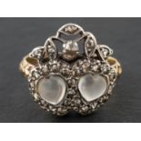 A 19th century, 'Luckenbooth' ring, depicting two cabochon-cut moonstone hearts entwined,