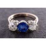 A sapphire and cushion-cut diamond, three-stone ring, total estimated sapphire weight ca. 1.