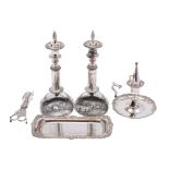 A pair of plated telescopic candlesticks, a plated chamberstick with snuffer,