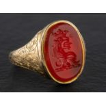 A carnelian signet ring, engraved with heraldic crest, length of ring head ca. 1.