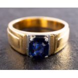 An octagonal, step-cut synthetic sapphire, single-stone ring, length of ring head ca. 0.