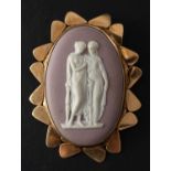 A 9ct gold Wedgwood, lilac, jasperware brooch, depicting two classical ladies in conversation,